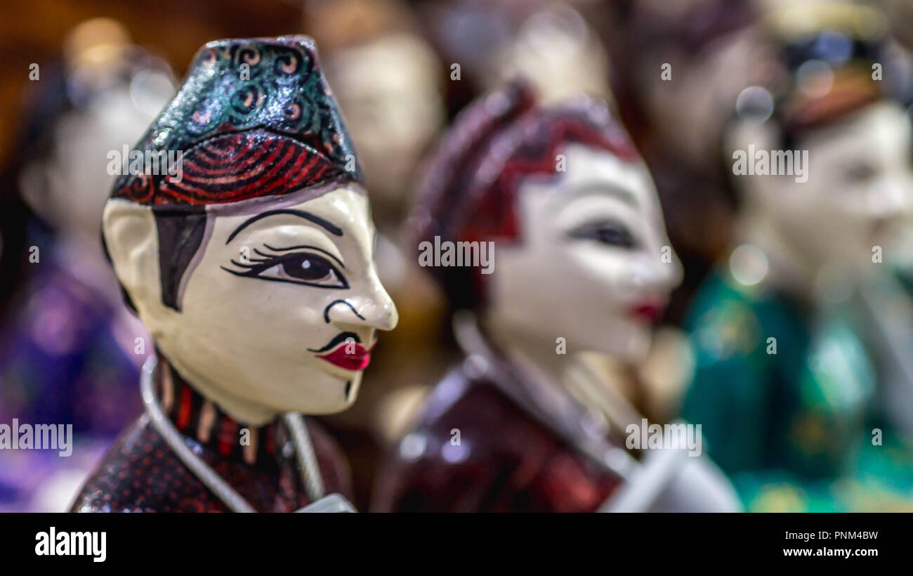 Wooden statue of Javanese groom and bride called `Loro Blonyo` sold as souvenir for the tourist Stock Photo